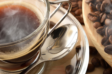 Cup of hot coffee and beans close up top view, a Food & Drink Photo by Davizro's Market