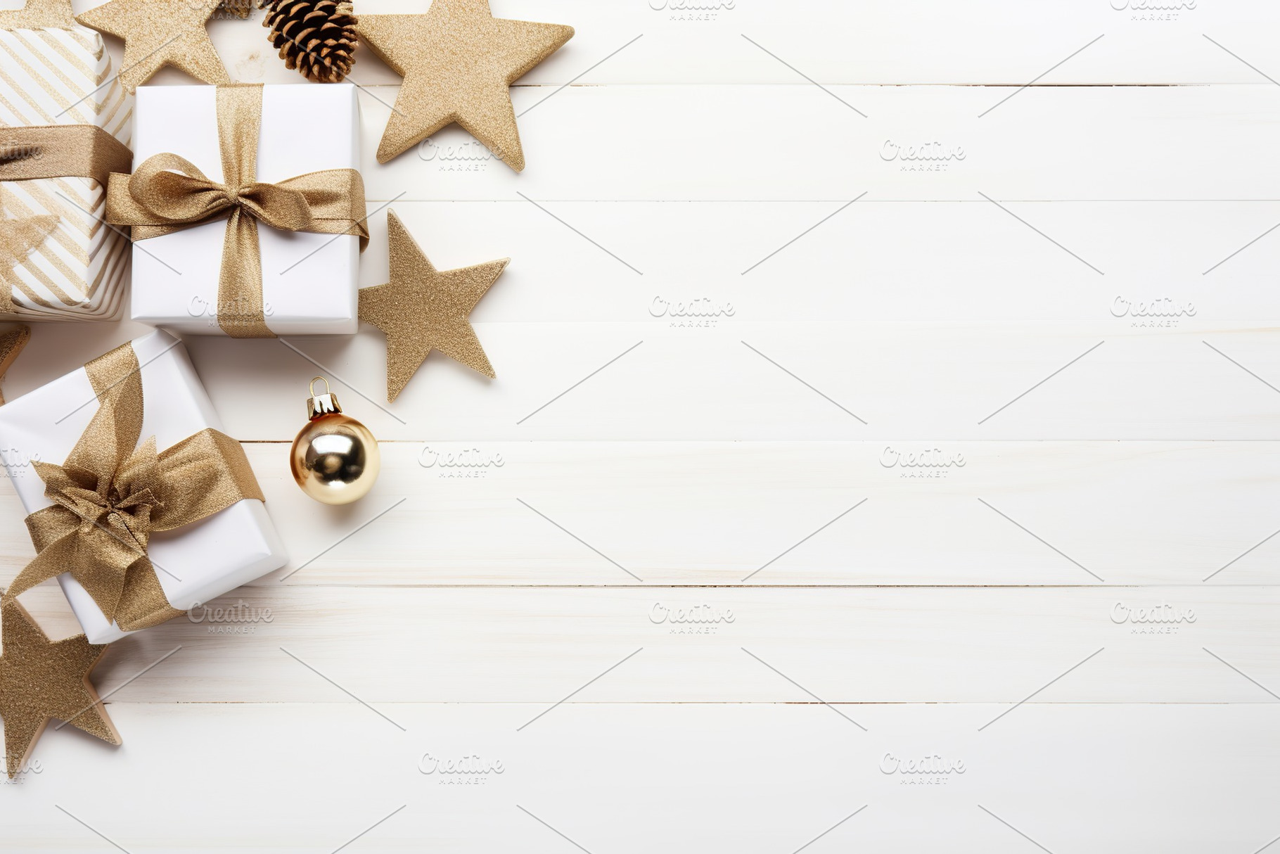 Christmas gift boxes on white wooden background, a Holiday Photo by AlyaAnd