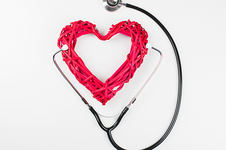 Closeup of creative composition made with big mockup heart and stethoscope on, a Health & Medical Photo by José Luis Agudo