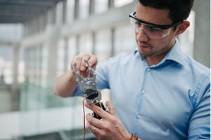Male technician adjusting mechanical, an Industrial Photo by HalfPoint