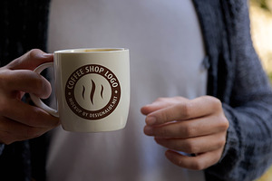 Man Holding Coffee Mug Mockup 2