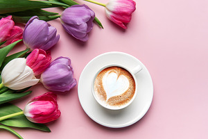Tulips and coffee with latte art heart on pink background, a Holiday Photo by Olena Rudo