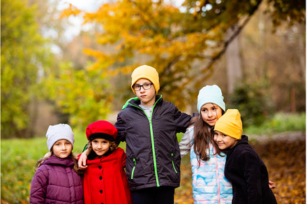 Group of friends play in autumn park, a Nature Photo by oksix