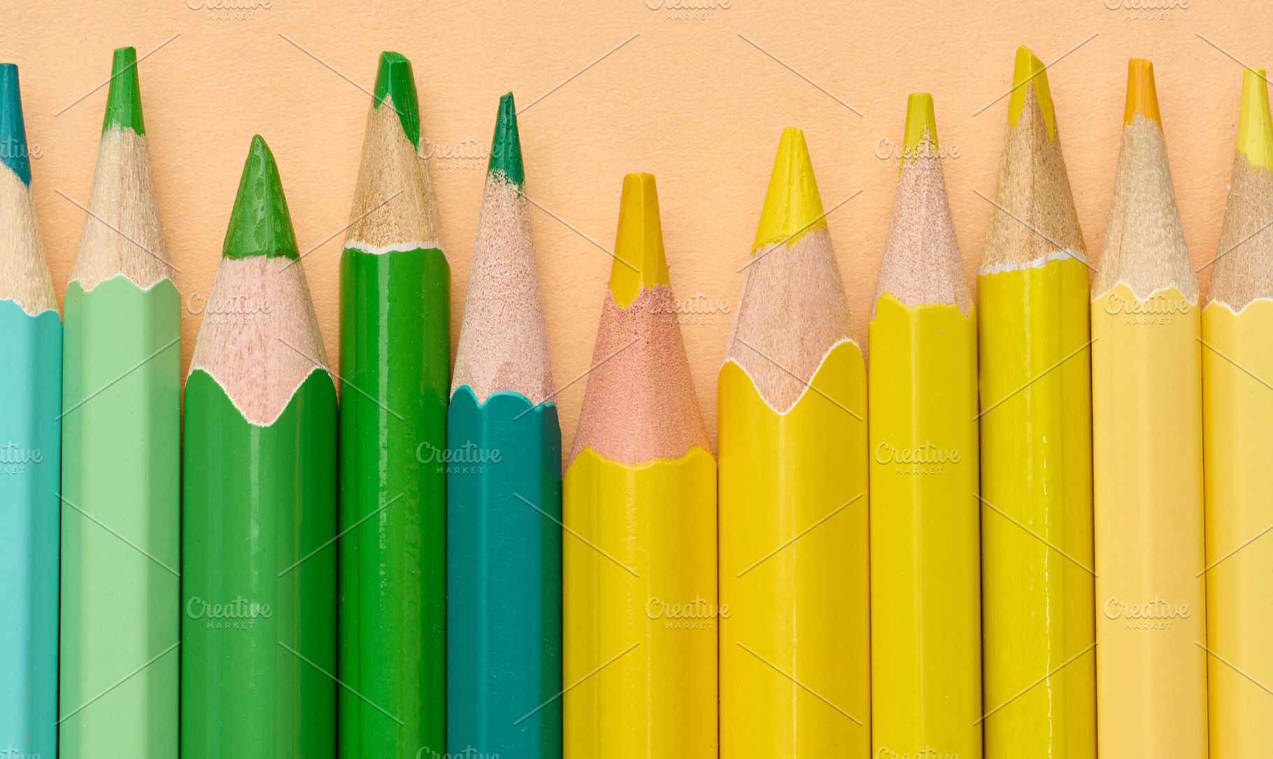 Multicolored wooden pencils in a row, drawing and creativity too, a School & Education Photo by ndanko