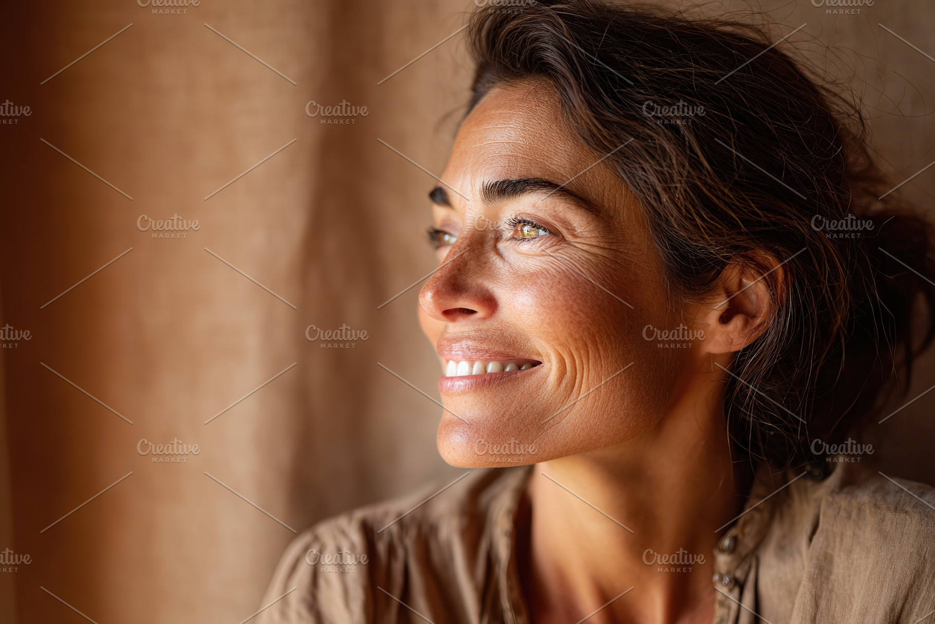 Woman smiles softly while gazing out a window with warm sunlight illuminating h, a Person Photo by AlyaAnd