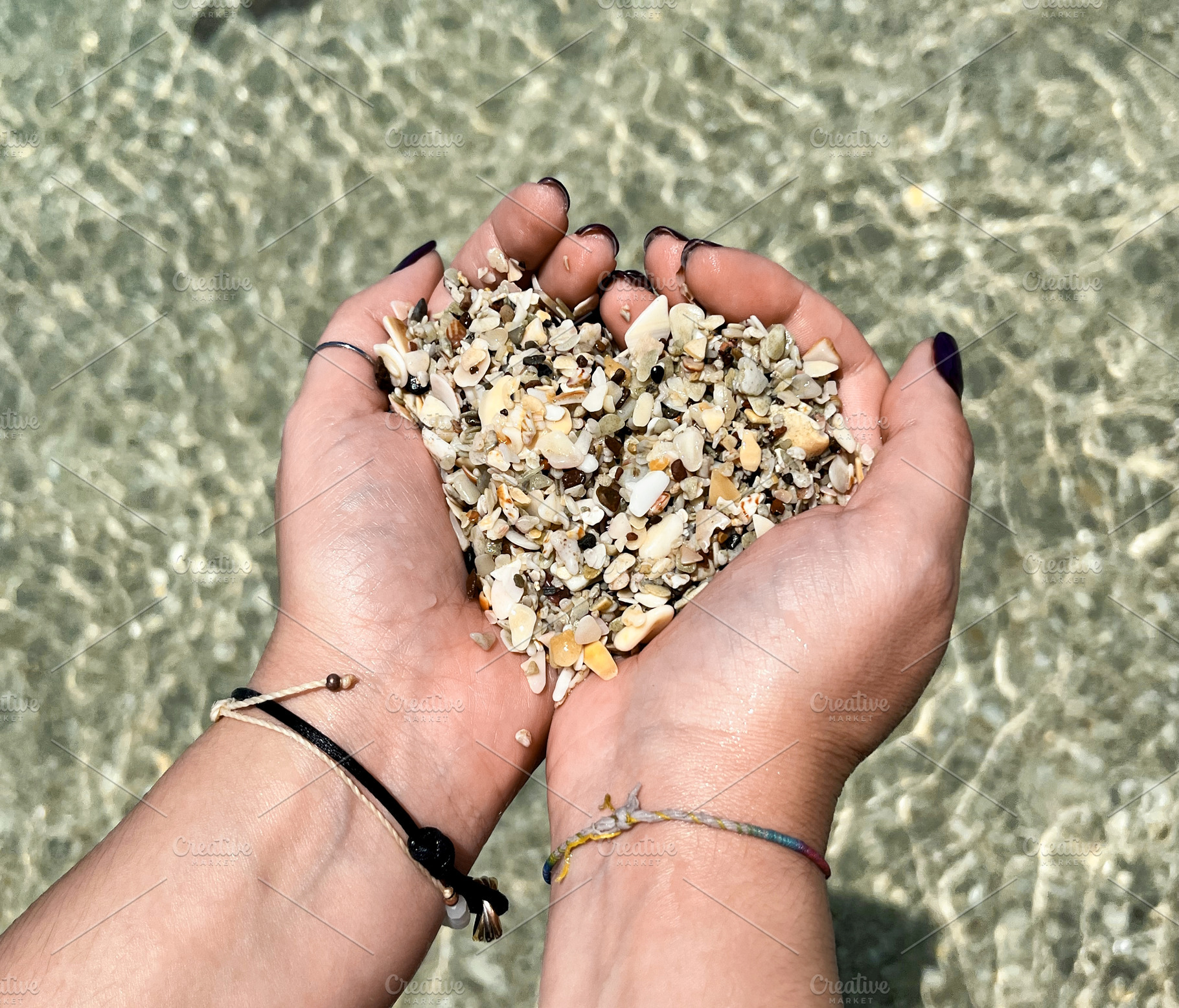 Hands in the shape of a heart with shells from Playa Conchal bea, a Nature Photo by Antonio Gravante Market