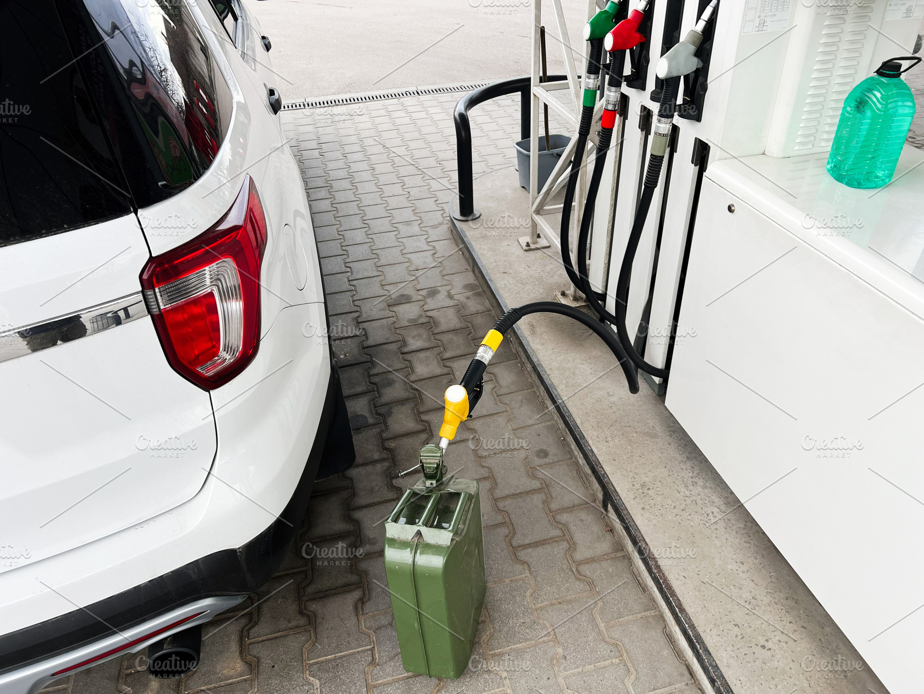 Car refueling at gas station with metal jerrycan and fuel pump, a Photo by AS photostudio