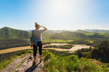 Woman in altai mountain containing mountain, peak, and cliff, a Person Photo by Jan Jack Russo Media