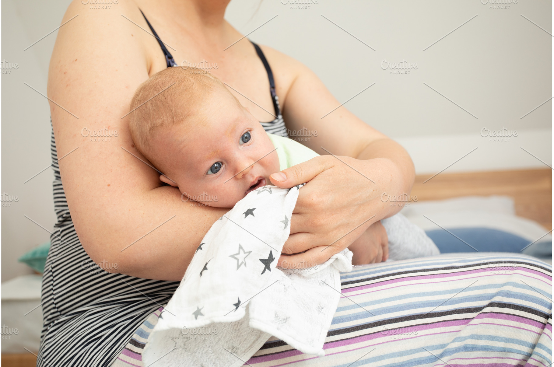 Mother holding and rocking baby, a Person Photo by oksix
