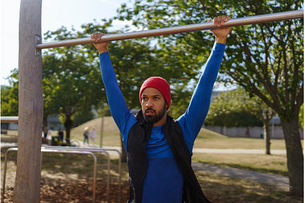 Handsome man exercises outdoors at, a Sports & Recreation Photo by HalfPoint