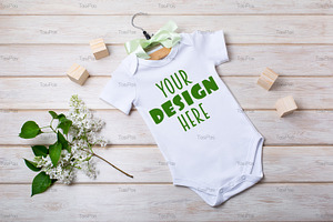 Baby onesie mockup with white lilac.
