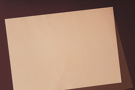 Beige and brown A4 papers as office stationery flatlay, luxury b, a Business Photo by Anneleven