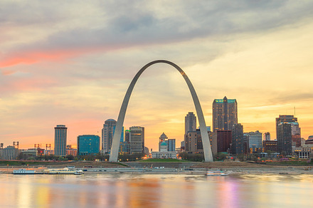 St louis skyline at sunsett featuring mississippi river, water, and monument, an Architecture Photo by f11photo