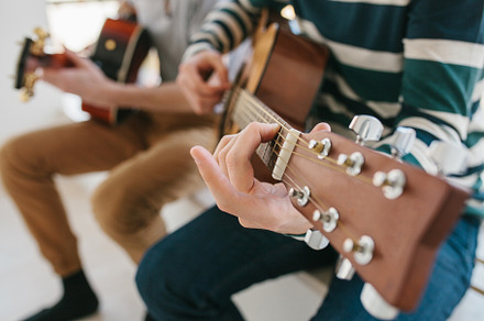 Learning to play the guitar stock photo containing music and guitar
