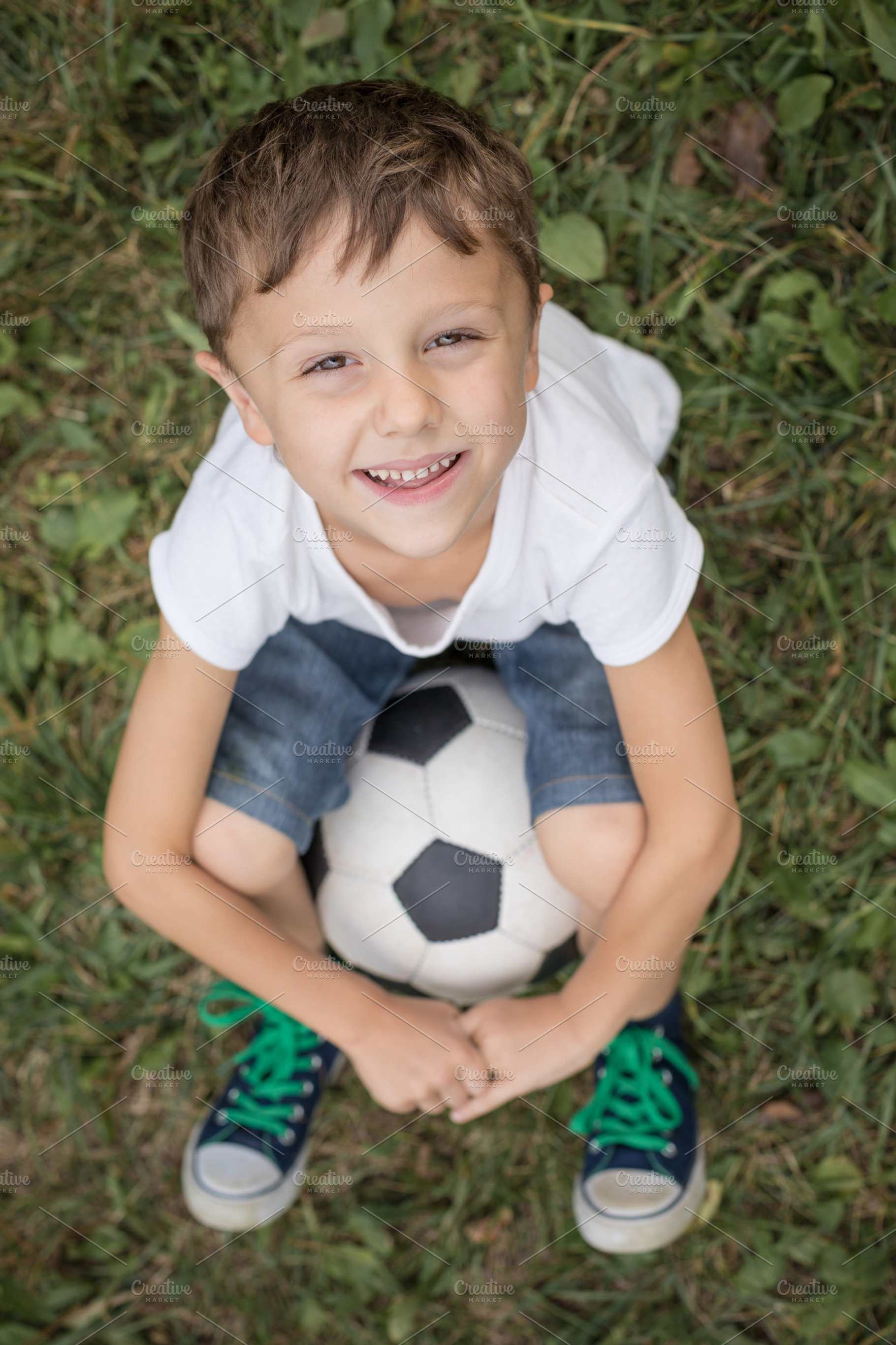 Young boy with soccer ball stock photo containing sport and football, a Sports & Recreation Photo by altanaka