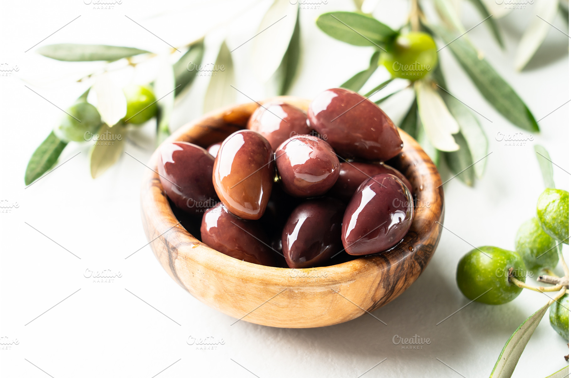 Olives in the bowl at white table., a Food & Drink Photo by Nadia-nb