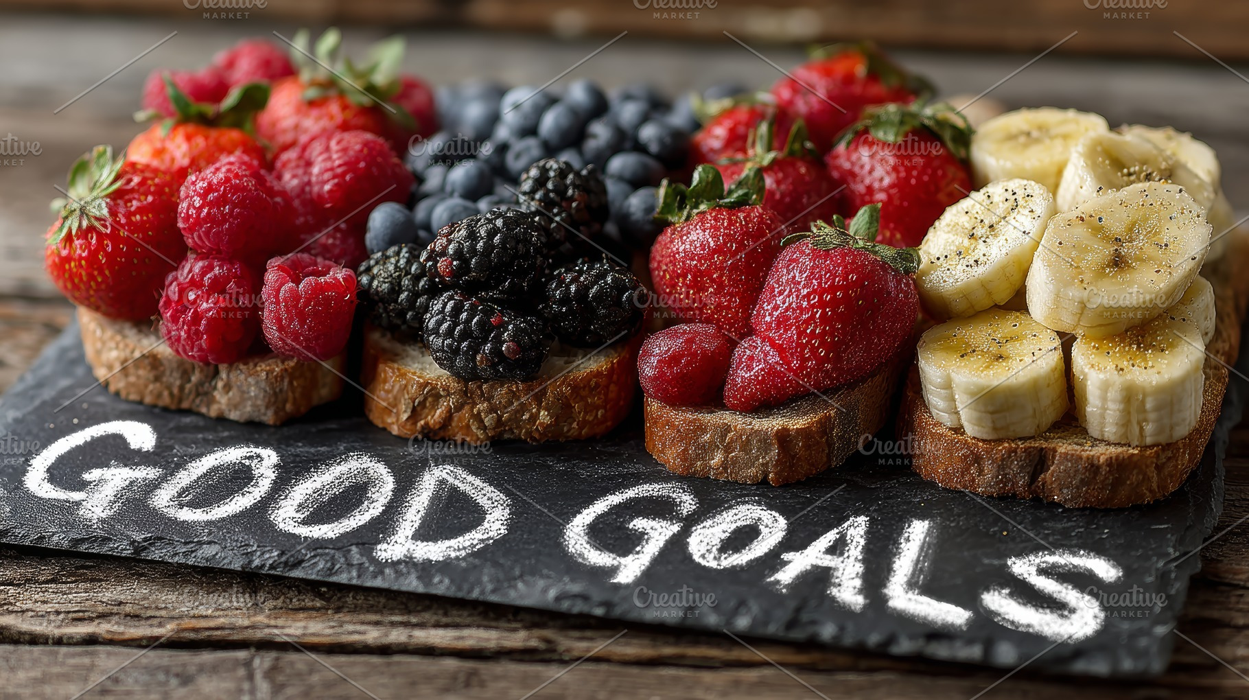 Healthy goals: fresh fruit toast with strawberries, bananas and mixed berries o, a Photo by AS photostudio