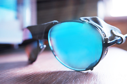 Mountain sunglasses on wooden table backdrop, a Sports & Recreation Photo by RETROWAVE '88
