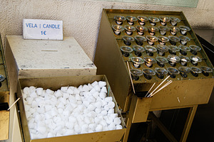 Candles available for lighting in Fatima, Portugal religious location, a Photo by AS photostudio