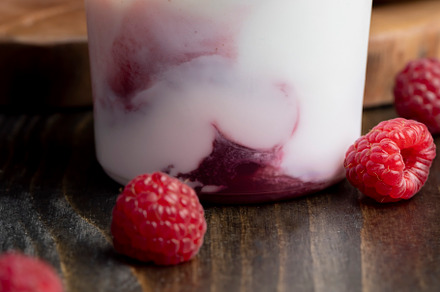 Fresh delicious milk yogurt with raspberry flavor, a Background Photo by MyPhotos