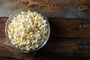 Pop corn on wood color background.Food and snack concepts ideas.Minimal style t, a Food & Drink Photo by Budarinphoto
