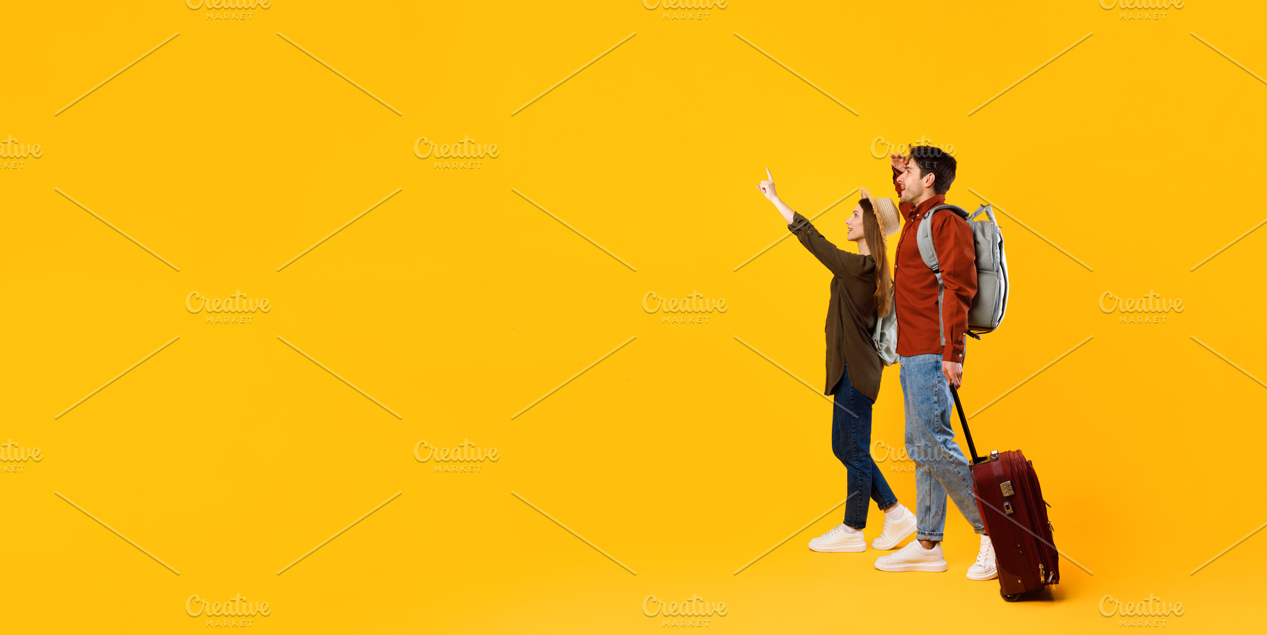 Travelers Couple Pointing Finger Looking Aside At Copy Space, Studio, a Photo by Prostock-Studio