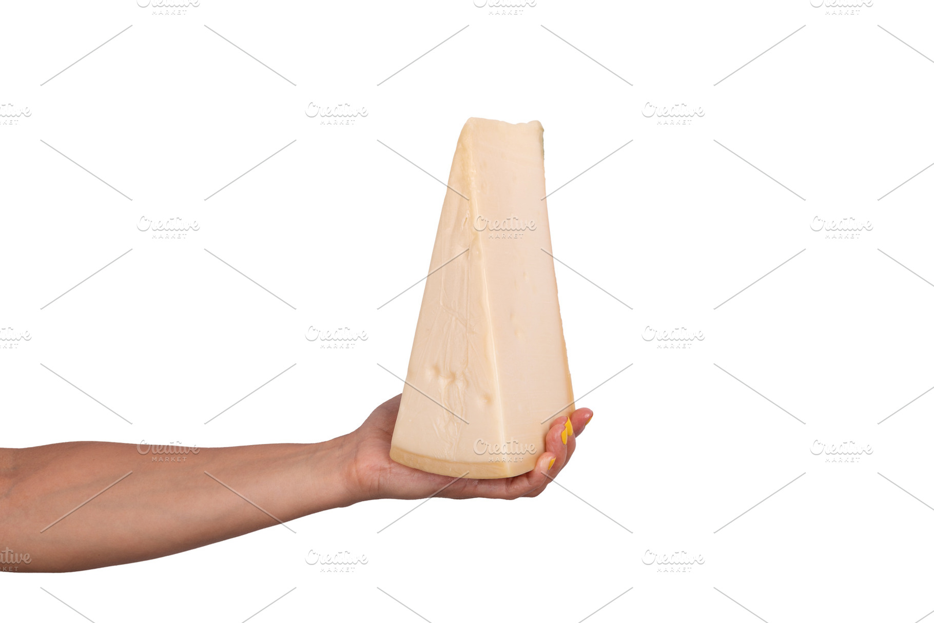 Large wedge of hard cheese held in a human hand, isolated on whi, a Food & Drink Photo by Ales Munt
