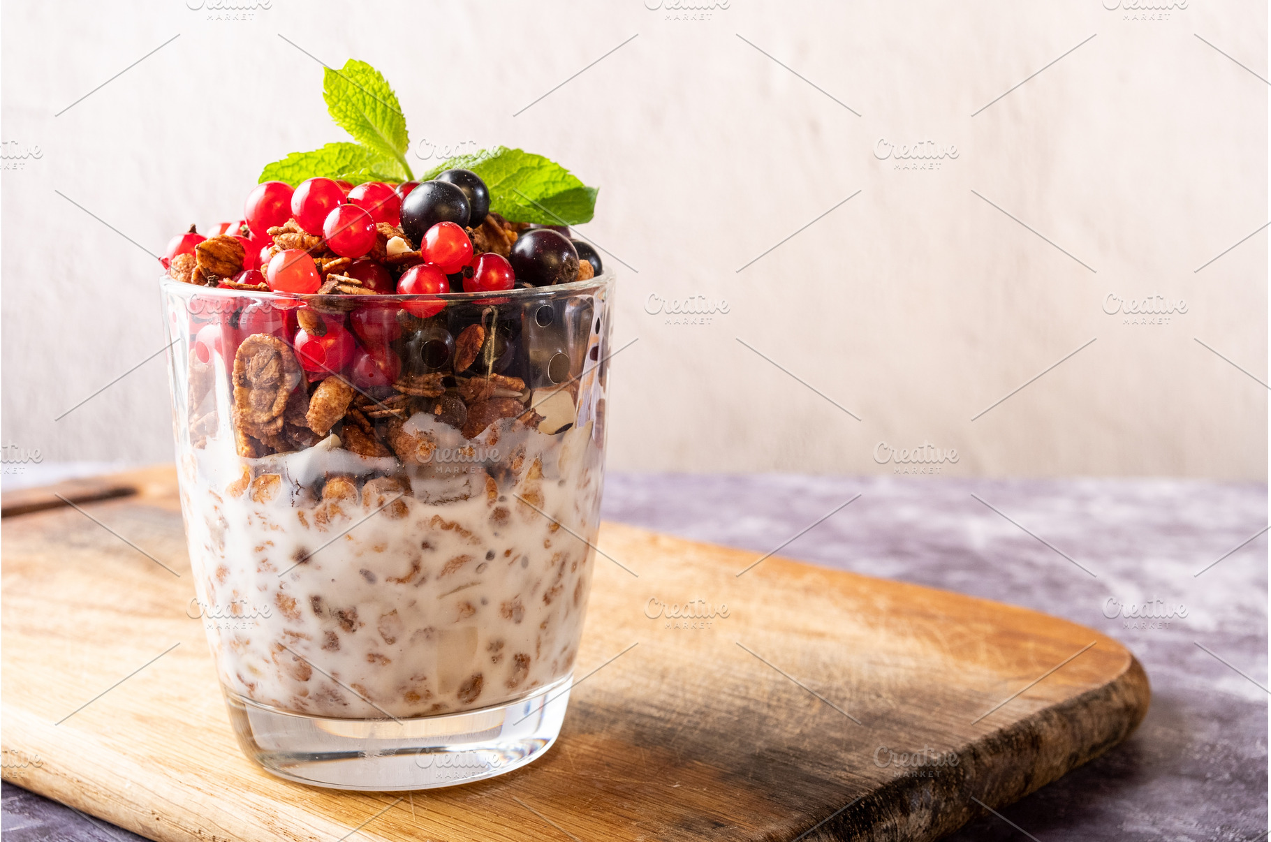 Healthy granola with milk, fresh red, a Food & Drink Photo by Stockphoto by vzwer