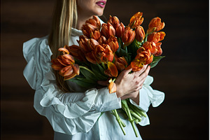 Woman Holding Lush Bouquet of Orange, a Beauty & Fashion Photo by wip3out