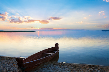 Sunset with boat near the summer lake shore, a Nature Photo by YuriyB