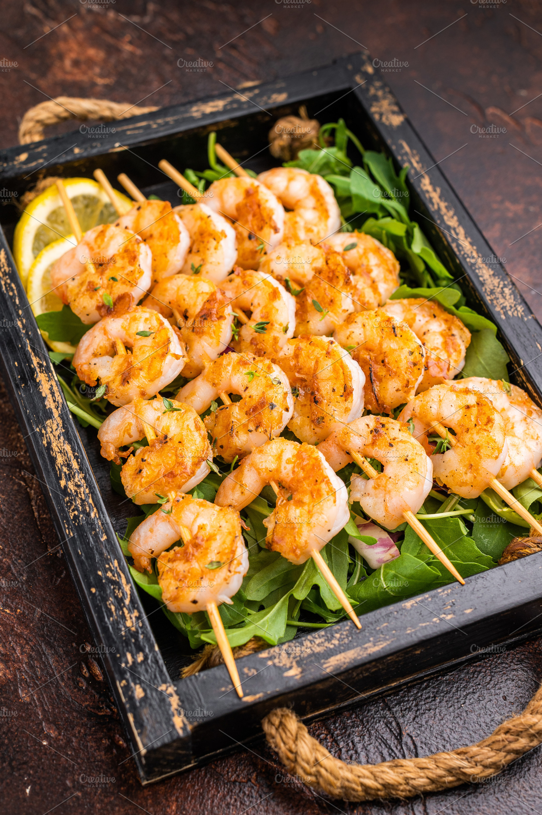 Grilled shrimp prawn skewers served in a rustic wooden box with, a Food & Drink Photo by composter-box@mail.ru