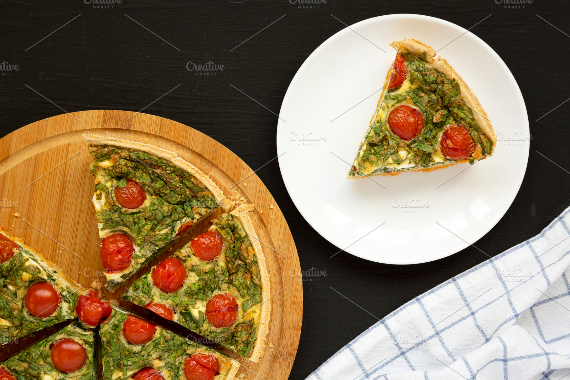 Homemade Spinach Quiche on a white plate on a black background,, a Food & Drink Photo by LiudmylaChuhunova