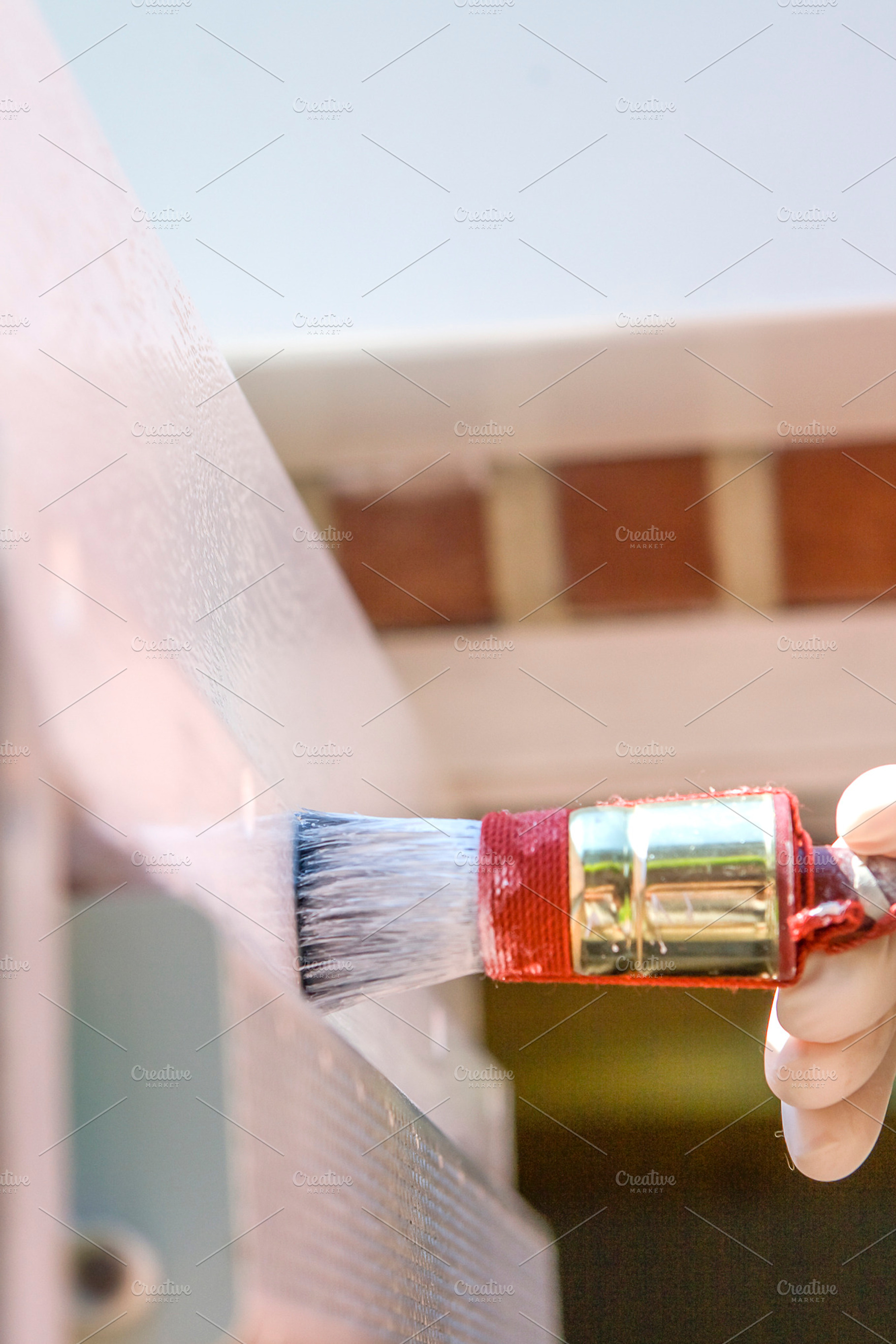 Paintbrush containing house, painter, and painting