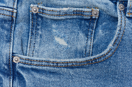 Blue jeans front pocket with buttons, a Background Photo by ndanko