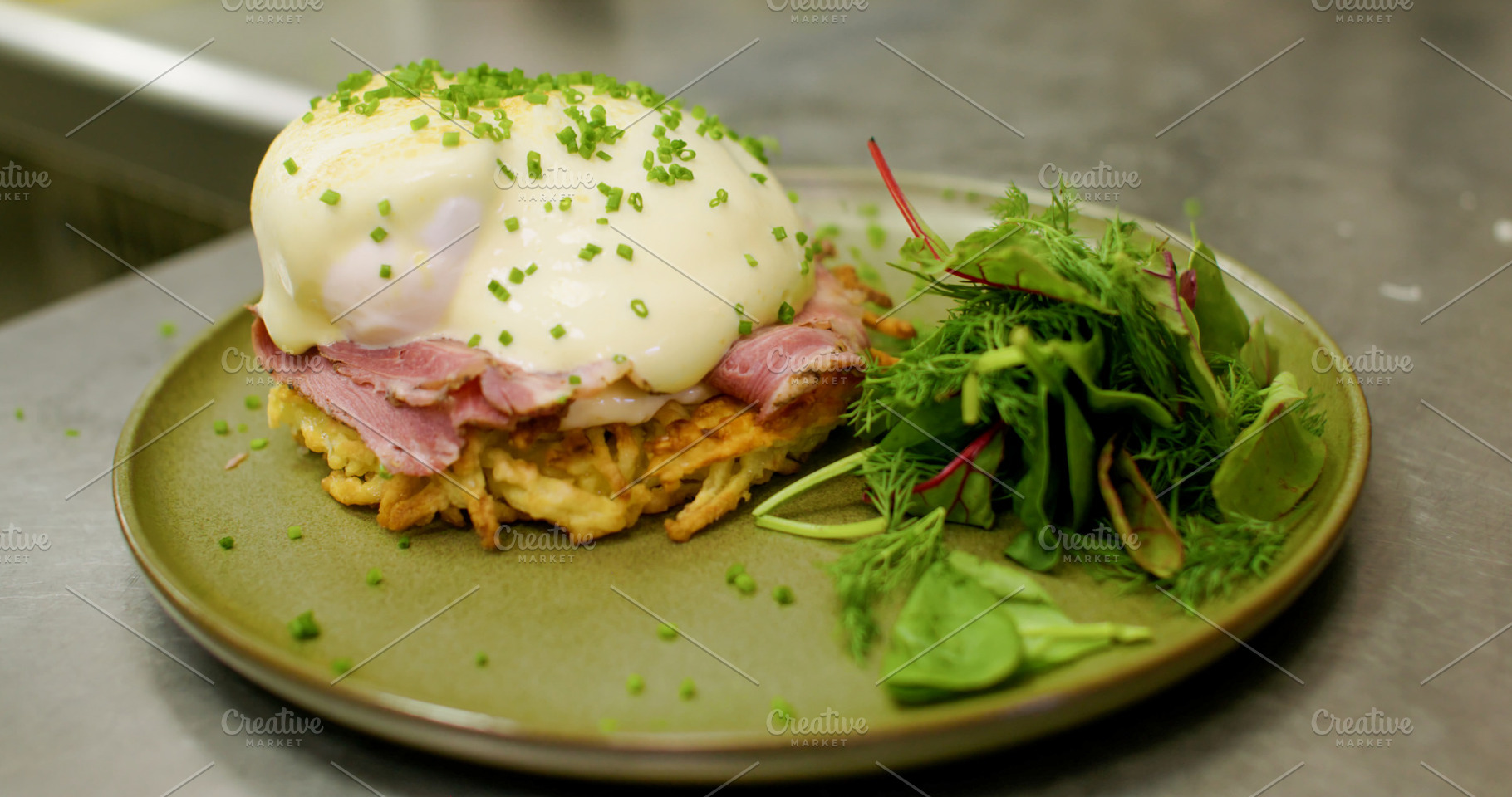Egg benedict brunch meal salad ham sauce plate, a Food & Drink Photo by Photo Drive Studio
