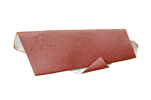 Old sandpaper isolated, an Industrial Photo by BOOCYS