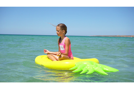 Adorable girl on inflatable air, a Person Photo by travnikovstudio