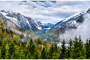 Mountains above lake predil in italy featuring alps, landscape, and italy, a Nature Photo by Leonid Andronov