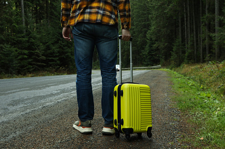 Adventure and tourism concept, young man traveling by auto stop, a Nature Photo by AtlasStudio PRO