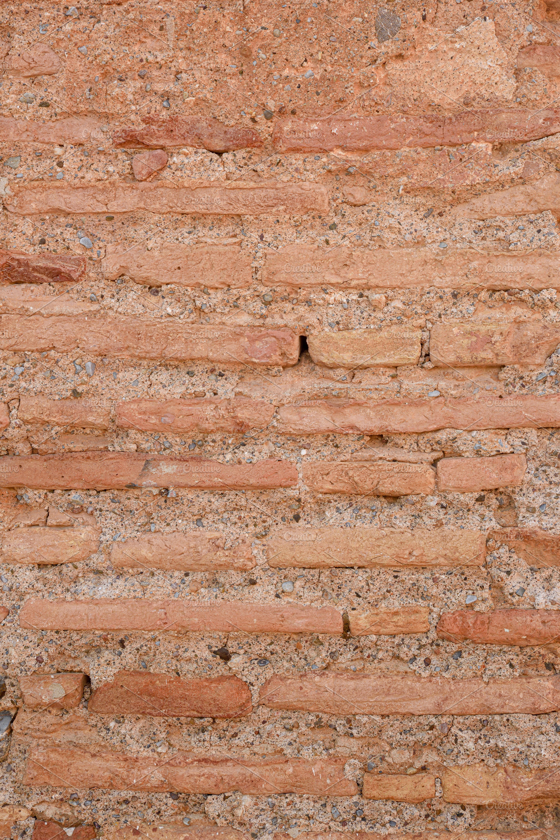 Old wall of elongated reddish-brown bricks joined with gray ceme, an Abstract Photo by Davizro's Market