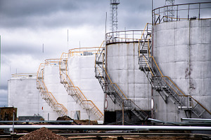 Large oil tank in industrial plant featuring oil, tank, and storage, an Industrial Photo by UltraShop