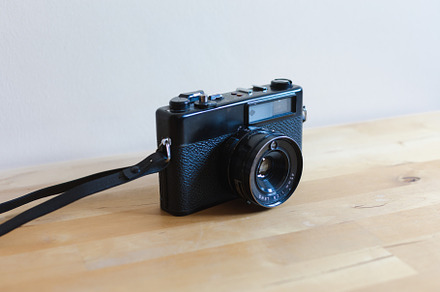 Vintage camera on a wooden table, a Technology Photo by OSORIOartist