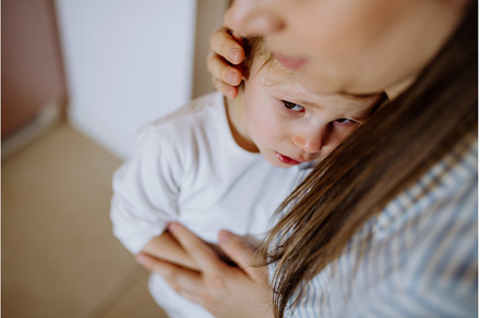 Mother consoling her little upset, a Person Photo by HalfPoint