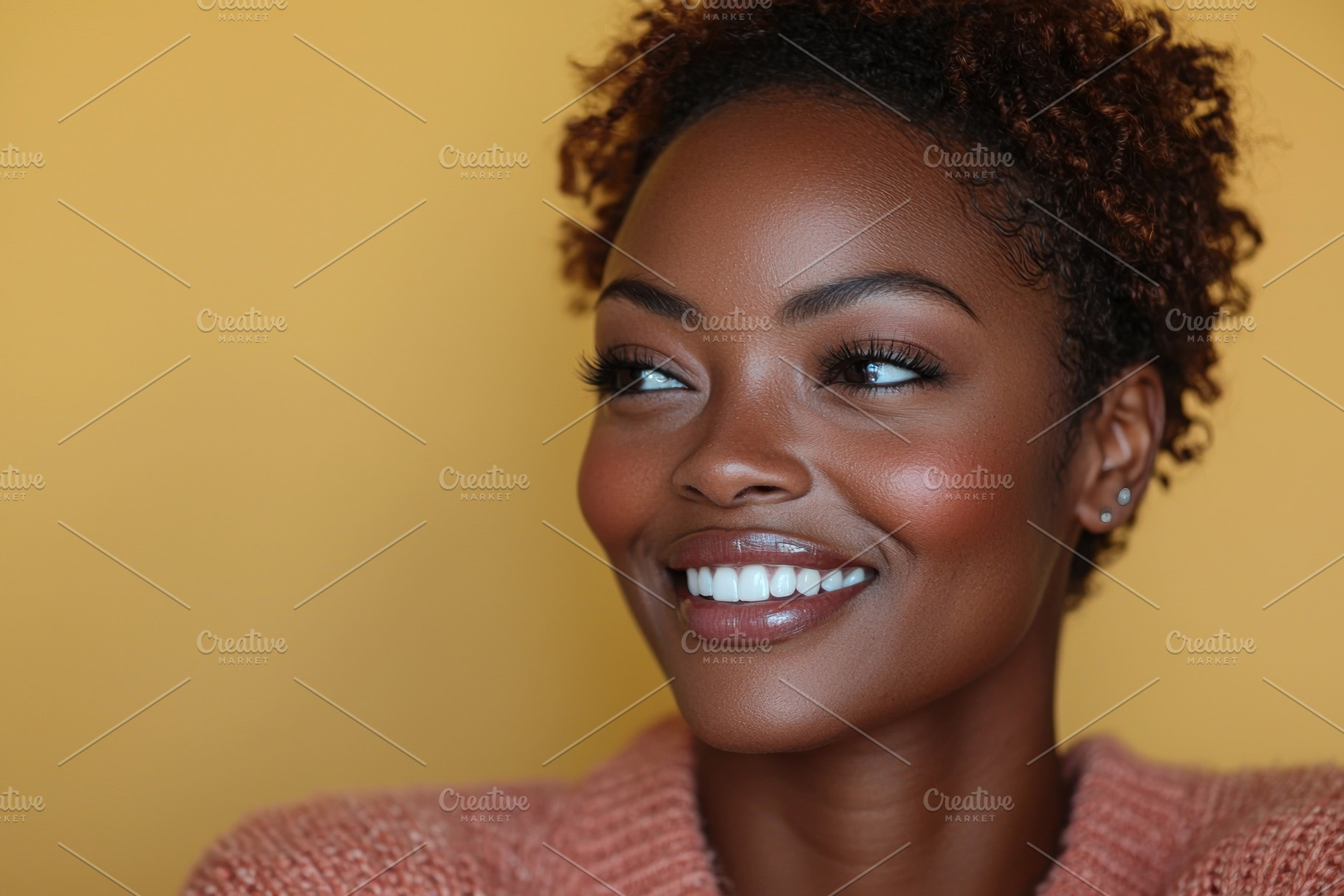 Smiling woman in pink turtleneck sweater with curly hair and earrings looking t, a Person Photo by José Manuel Gelpi