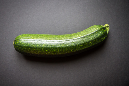 Zucchini isolated on a black background, a Food & Drink Photo by GoodGoods