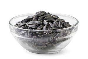 Sunflower seeds in a glass plate, a Food & Drink Photo by innakreativ