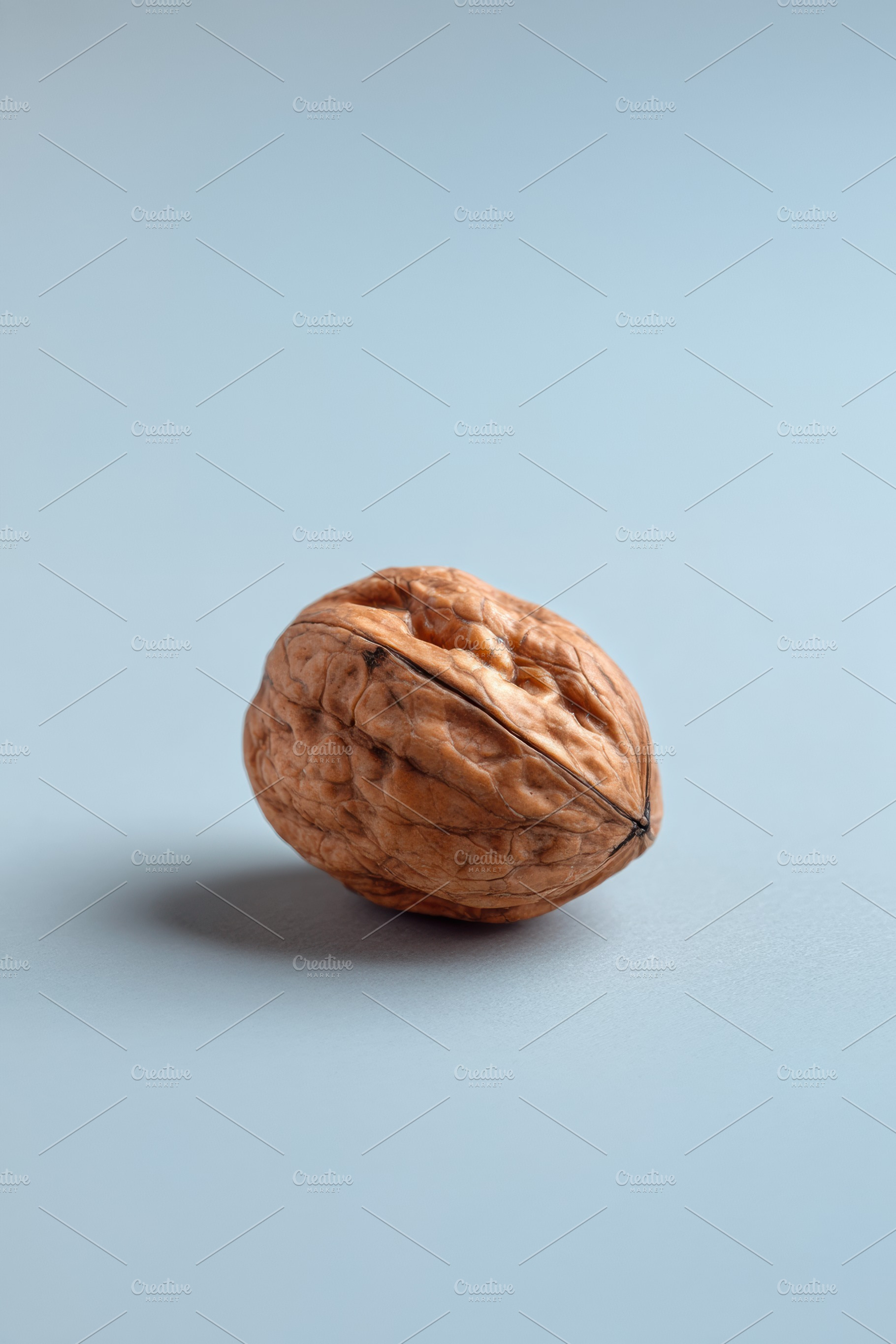 Single walnut centered, a Food & Drink Photo by Virgo Studio
