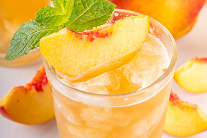 Summer cold drink, peach iced tea slushie cocktail, a Food & Drink Photo by Rimma