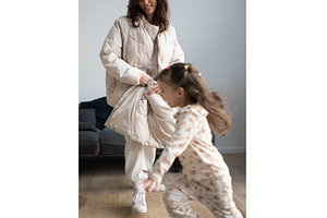Girl runs across room as mother, a Person Photo by undrey