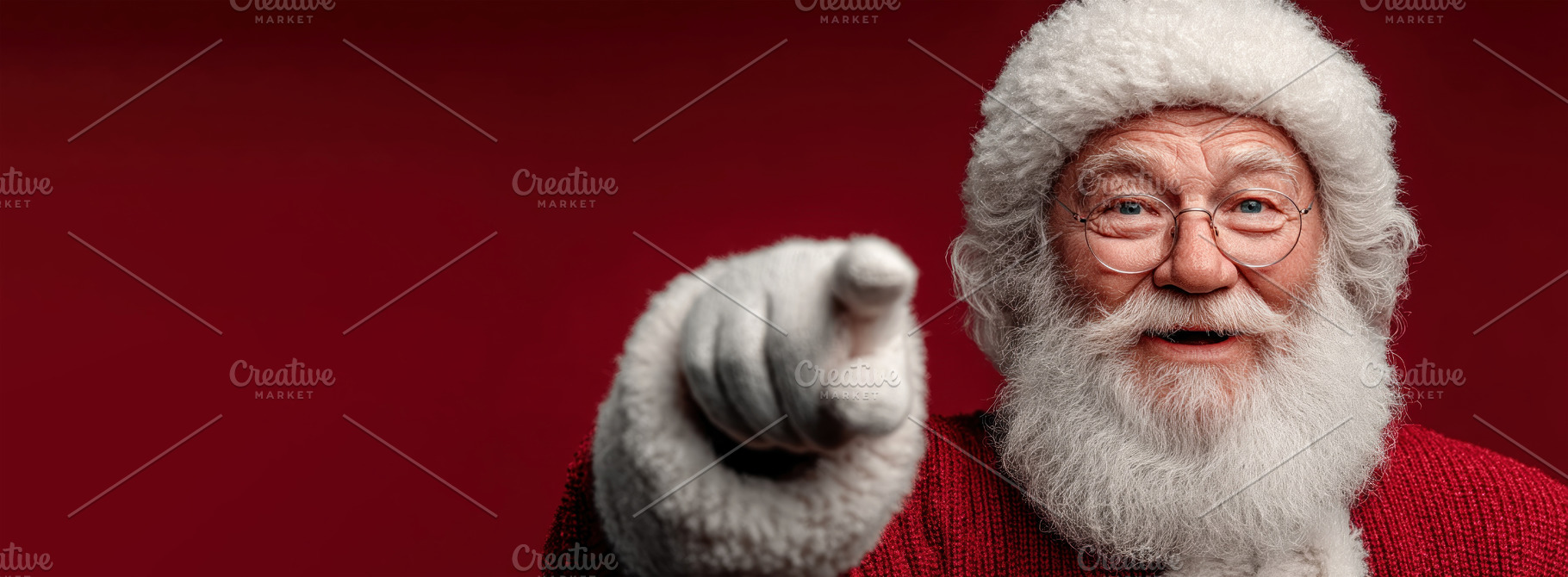 Happy Santa Claus smiling and pointing forward in red sweater an, a Person Photo by José Manuel Gelpi